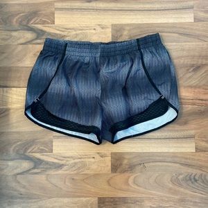 Black and gray running shorts with elastic waistband